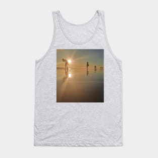 Silhouetted people in a row on a sand beach. Tank Top